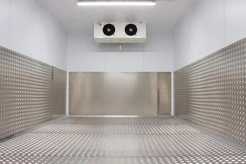 Industrial cold room interior showing insulated aluminum floor panels